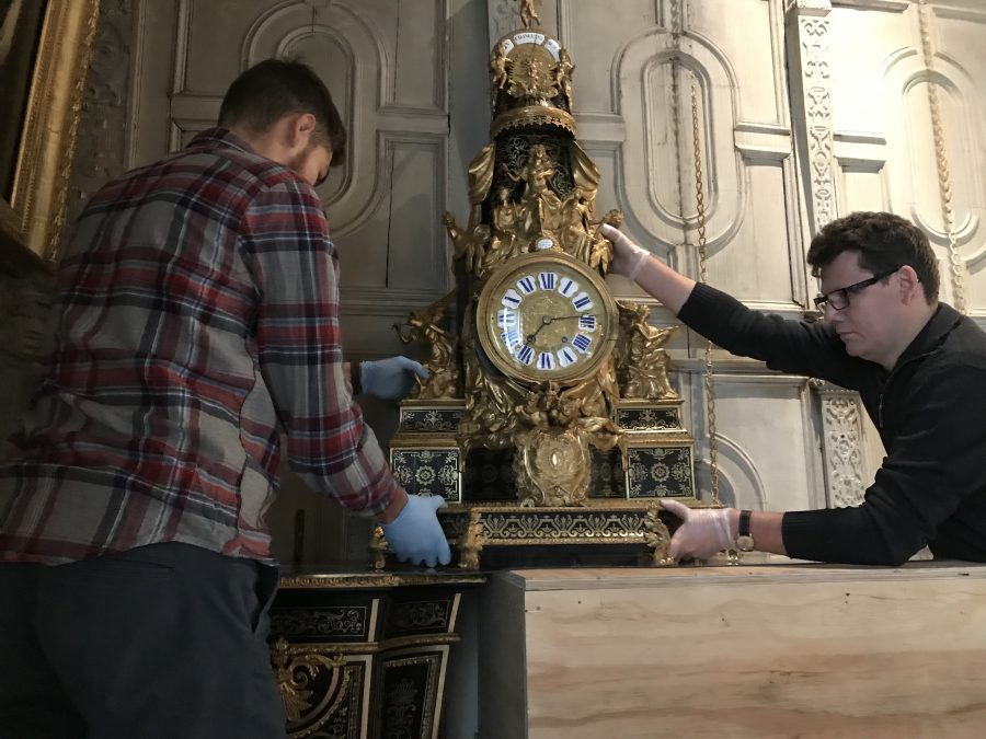 Installation of a Boulle clock at Knole House after conservation.  The National Trust.