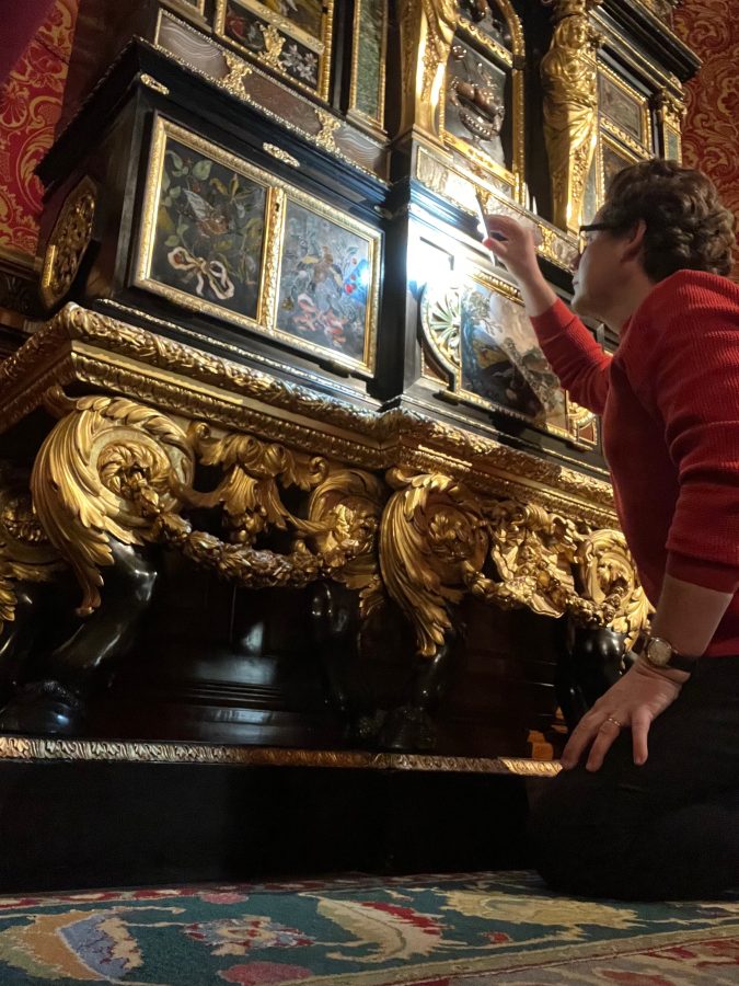 Yannick Chastang examining the pair of royal cabinets attributed to Domenico Cucci, made for Versailles in c.1685.  The Duke of Northumberland, Alnwick Castle. 